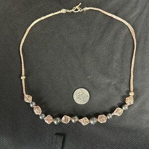 Hand crafted beaded necklace with wire mesh as the string beads are in the mesh